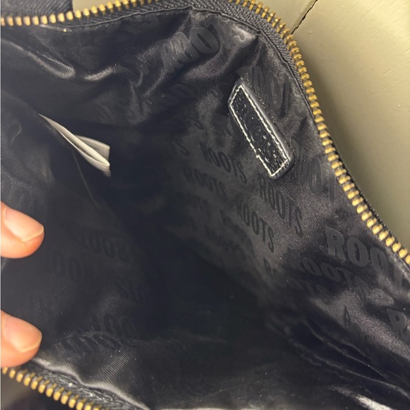 Roots Black Messenger Bag with Adjustable Straps and Minimalist Design - Picture 4 of 4